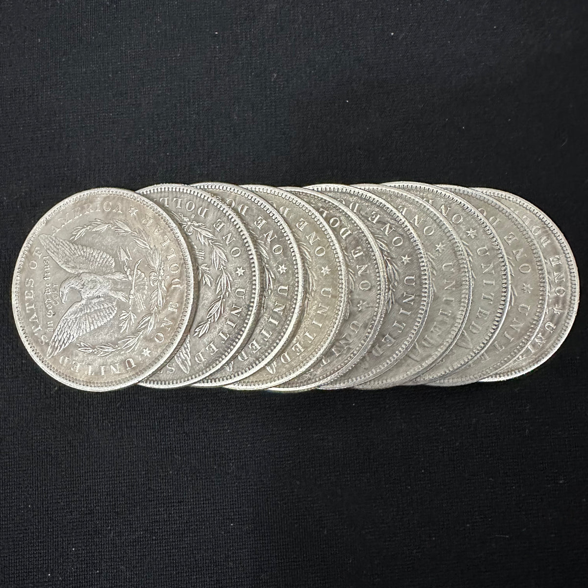 obverses of 10 morgan dollar replica coins from 1878 to 1887